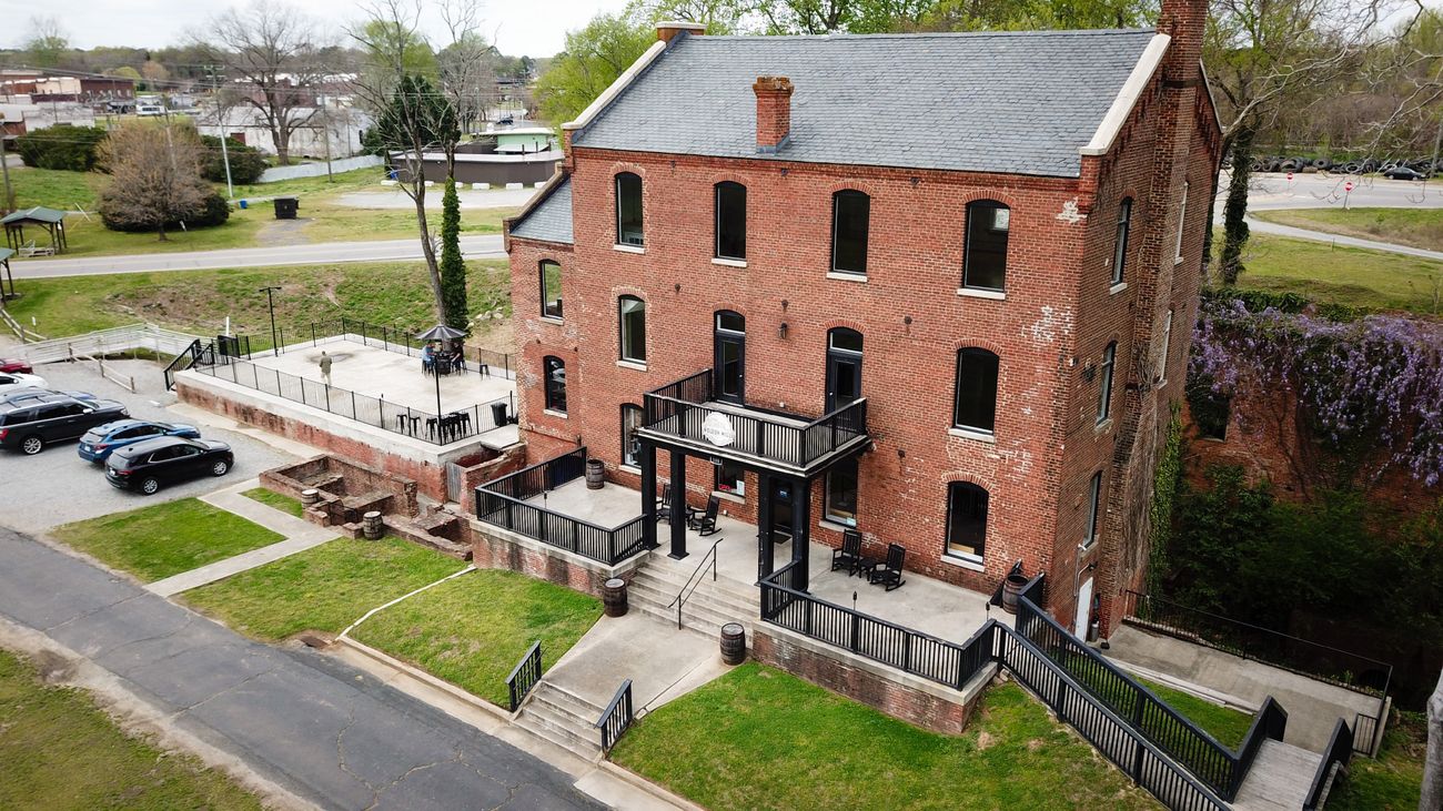 The restored 1892 grist mill that houses Weldon Mills Distillery